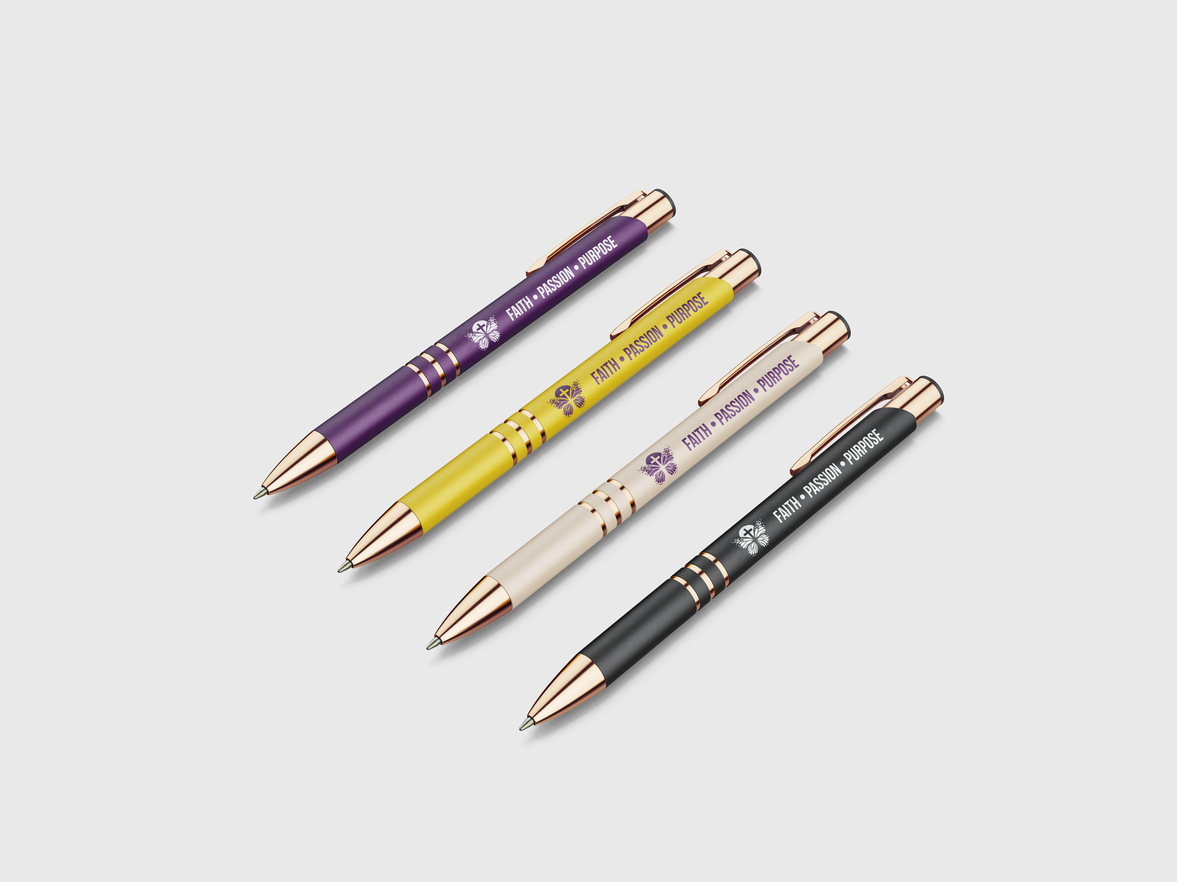 Variety of branded pens with the logo and slogan.