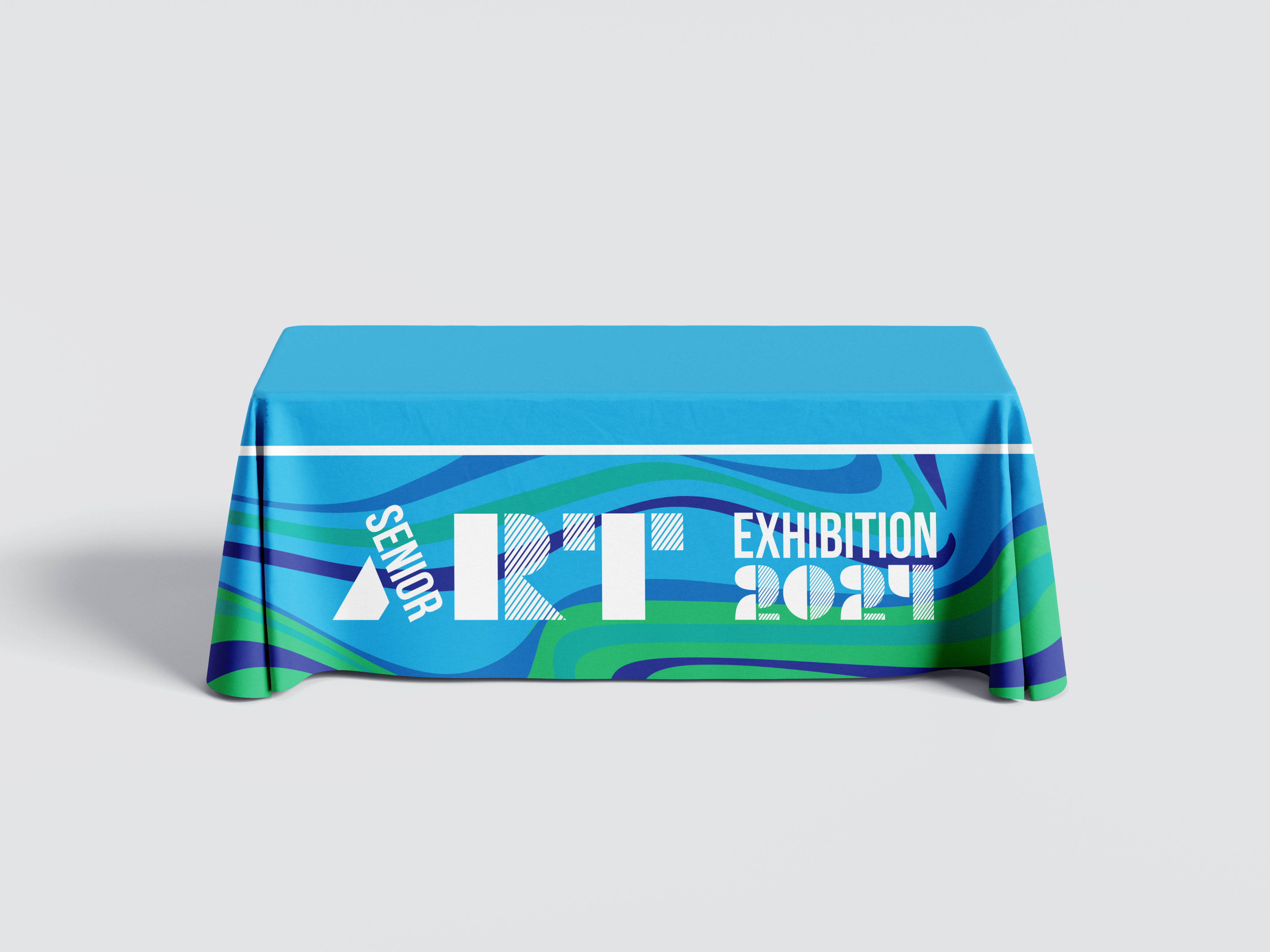 Branded tablecloth for the event on a rectangular table.